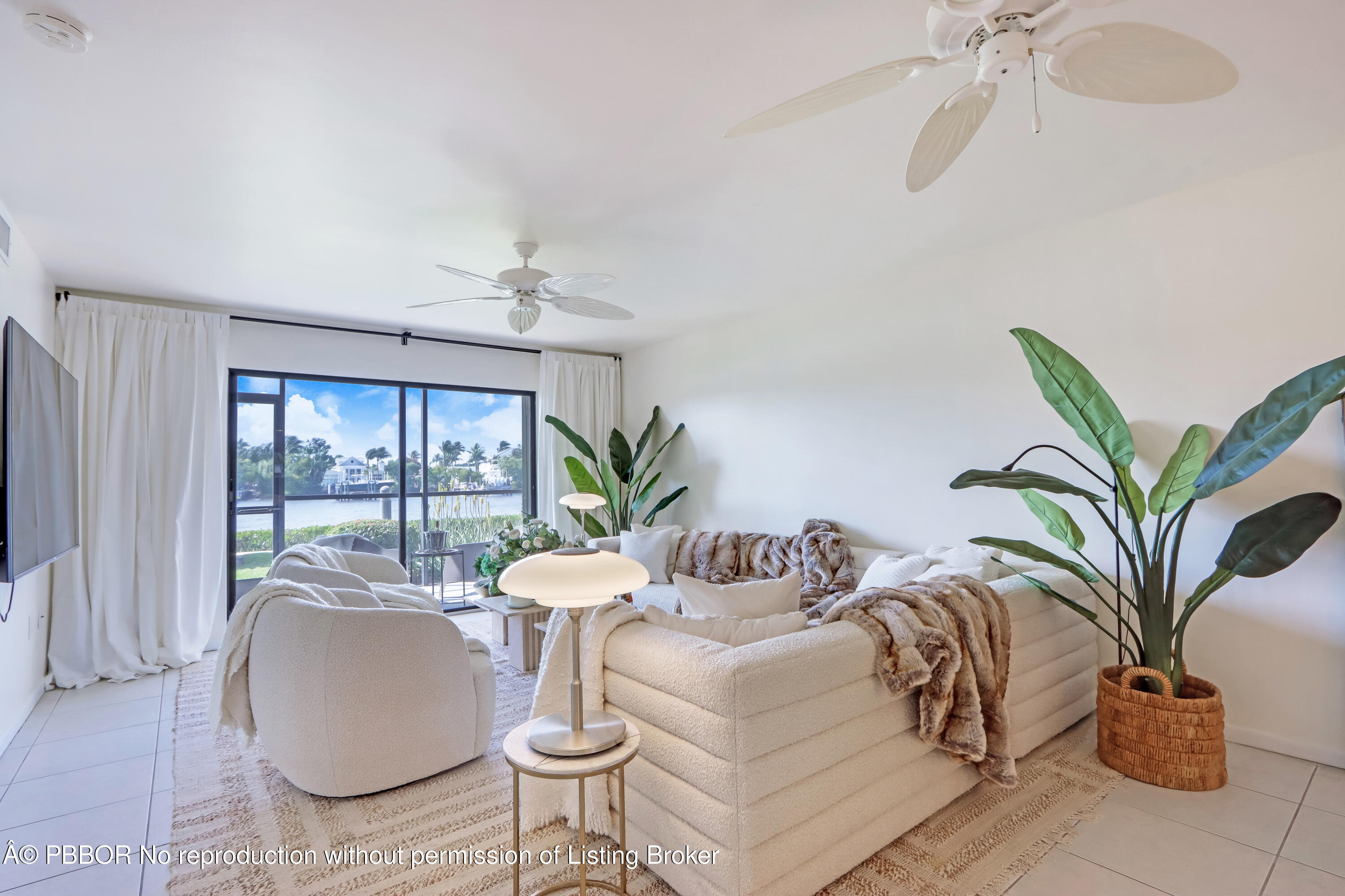 3525 South Ocean Boulevard, Unit 108 Palm Beach, FL 33480 - Photo 6 of 13 a living room with furniture potted plant and a window