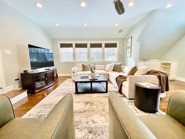 a bathroom with a sink a toilet a mirror and shower