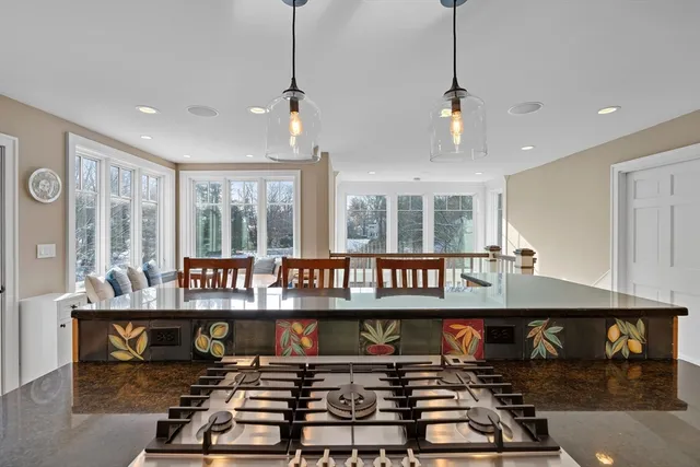 a bathroom with a granite countertop sink a mirror and a shower