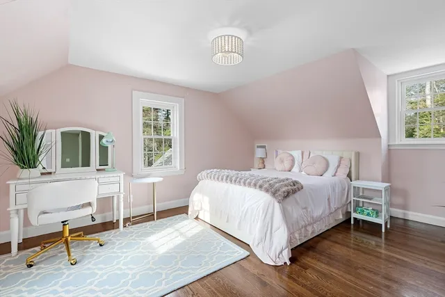 a view of a white house with a yard covered in snow