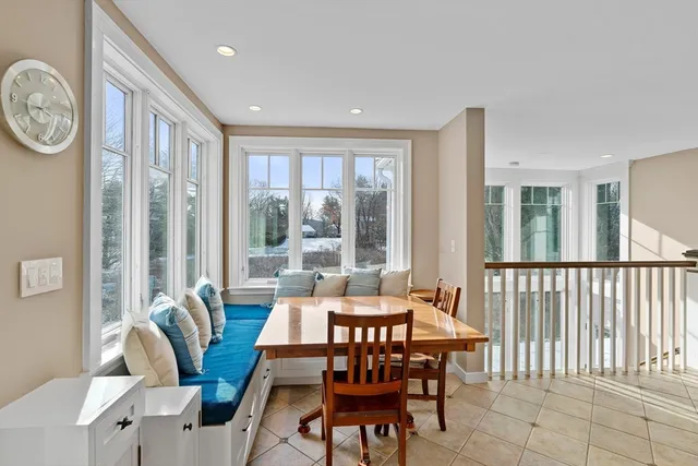 a living room with couches a coffee table and a fireplace