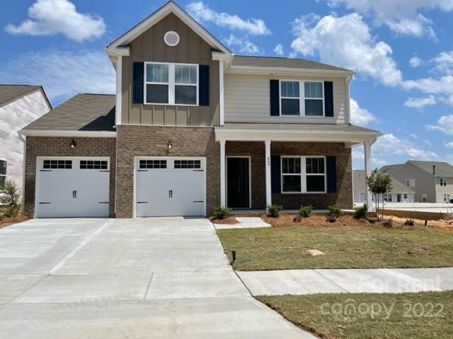 809 Alexander Commons Drive, Unit 34 Monroe, NC 28112 - Photo 1 of 28 a front view of a house with a yard