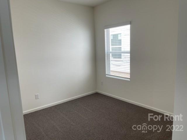 809 Alexander Commons Drive, Unit 34 Monroe, NC 28112 - Photo 13 of 28 an empty room with a window