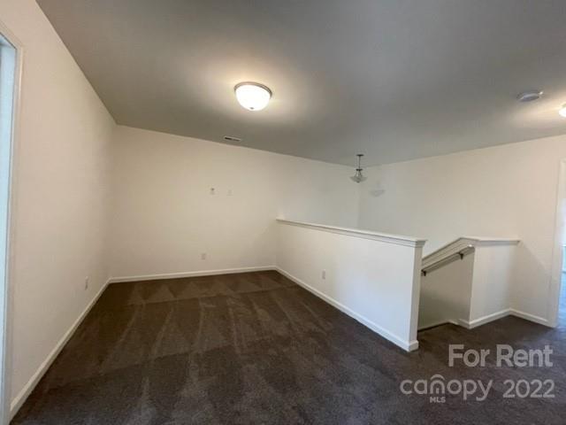809 Alexander Commons Drive, Unit 34 Monroe, NC 28112 - Photo 20 of 28 wooden floor in an empty room