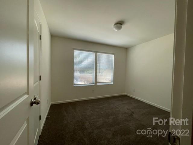 809 Alexander Commons Drive, Unit 34 Monroe, NC 28112 - Photo 21 of 28 an empty room with a window
