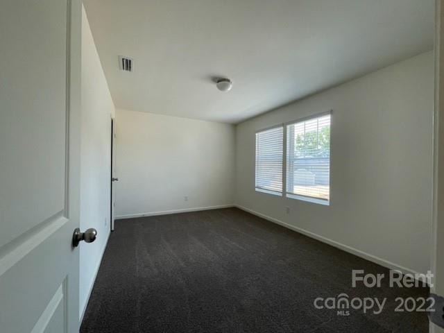 809 Alexander Commons Drive, Unit 34 Monroe, NC 28112 - Photo 22 of 28 an empty room with a window