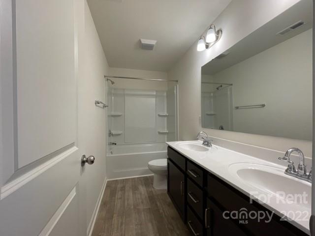 809 Alexander Commons Drive, Unit 34 Monroe, NC 28112 - Photo 23 of 28 a bathroom with a granite countertop sink a mirror and a bathtub