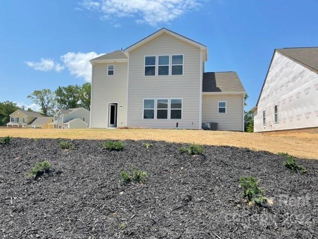 809 Alexander Commons Drive, Unit 34 Monroe, NC 28112 - Photo 27 of 28 a front view of a house with a yard