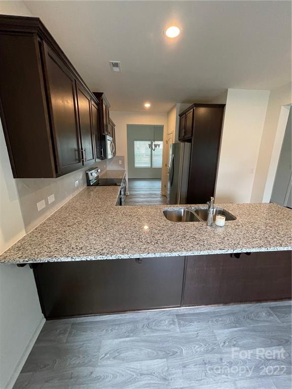 809 Alexander Commons Drive, Unit 34 Monroe, NC 28112 - Photo 10 of 28 a view of a large counter top