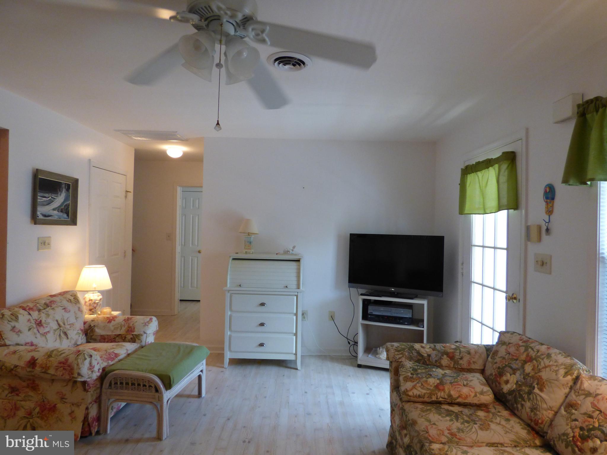 635 Sandy Point Road, Unit 31 Bethany Beach, DE 19930 - Photo 8 of 46 Living room and entrance/alternate view