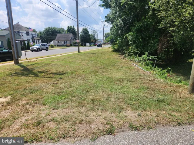 a view of a yard with of cars
