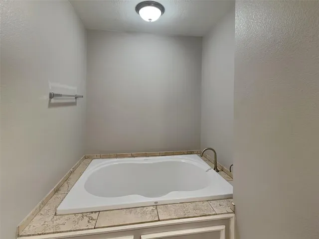 a view of a livingroom with wooden floor and a window