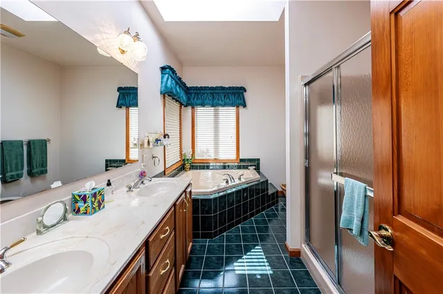 a bathroom with a double vanity sink and a mirror