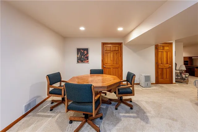 a dining room with a table and chairs