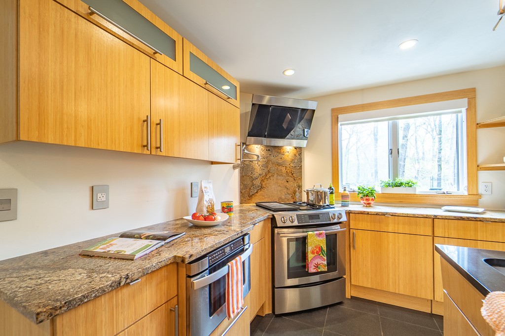 182 Park Road Perinton, NY 14534 - Photo 16 of 50 A contemporary range with a dramatic glass canopy