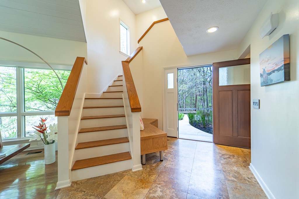 182 Park Road Perinton, NY 14534 - Photo 4 of 50 A dramatic, geometric two-story foyer immediately