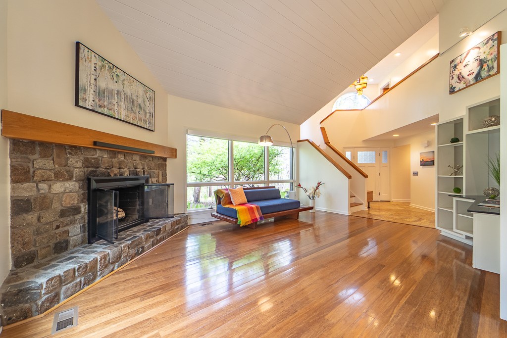 182 Park Road Perinton, NY 14534 - Photo 8 of 50 Centered around a wood-burning fireplace with a st
