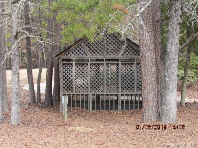 1045 Garnette Road Lancaster, SC 29720 - Photo 15 of 24 a view of a wooden house next to a yard