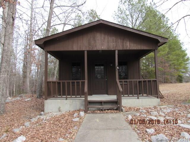 1045 Garnette Road Lancaster, SC 29720 - Photo 19 of 24 a view of a wooden house with a large window and wooden fence