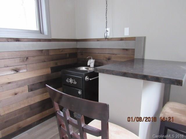 1045 Garnette Road Lancaster, SC 29720 - Photo 3 of 24 a stove top oven sitting inside of a kitchen