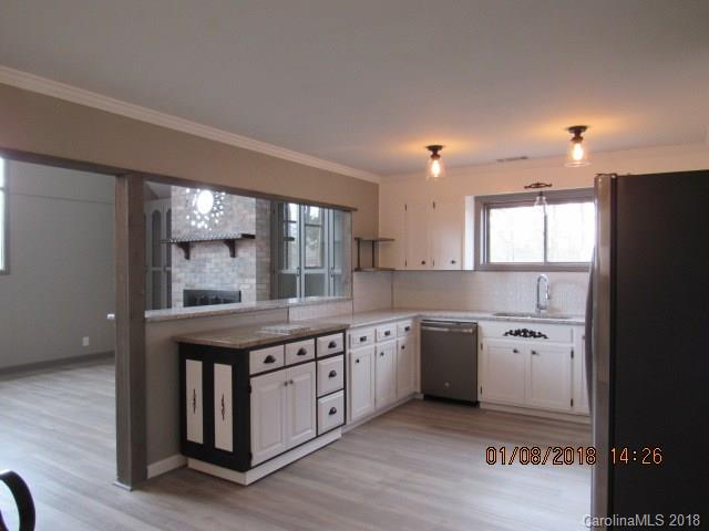 1045 Garnette Road Lancaster, SC 29720 - Photo 5 of 24 a kitchen with a stove a sink and a refrigerator