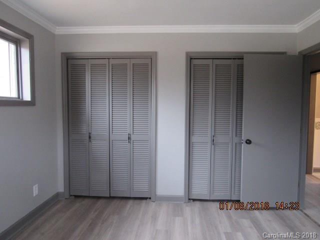 1045 Garnette Road Lancaster, SC 29720 - Photo 8 of 24 an empty room with wooden floor and windows