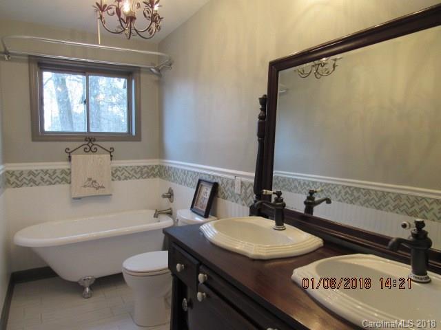 1045 Garnette Road Lancaster, SC 29720 - Photo 9 of 24 a bathroom with a granite countertop sink and a mirror