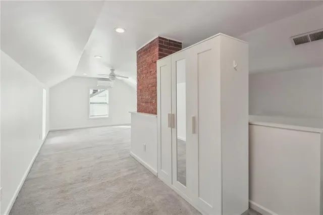 a bathroom with a double vanity sink toilet mirror and shower