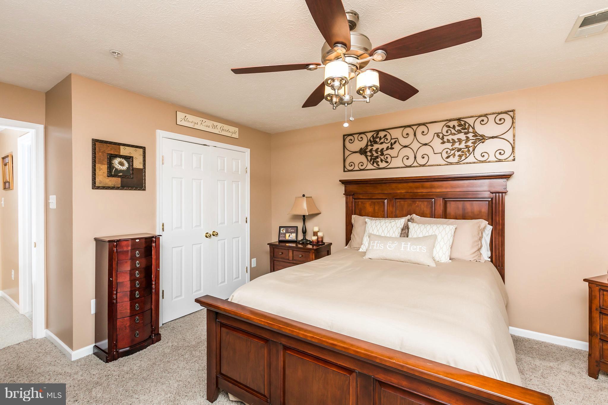 890 Lowe Road Middle River, MD 21220 - Photo 14 of 24 a bedroom with a bed and a chandelier