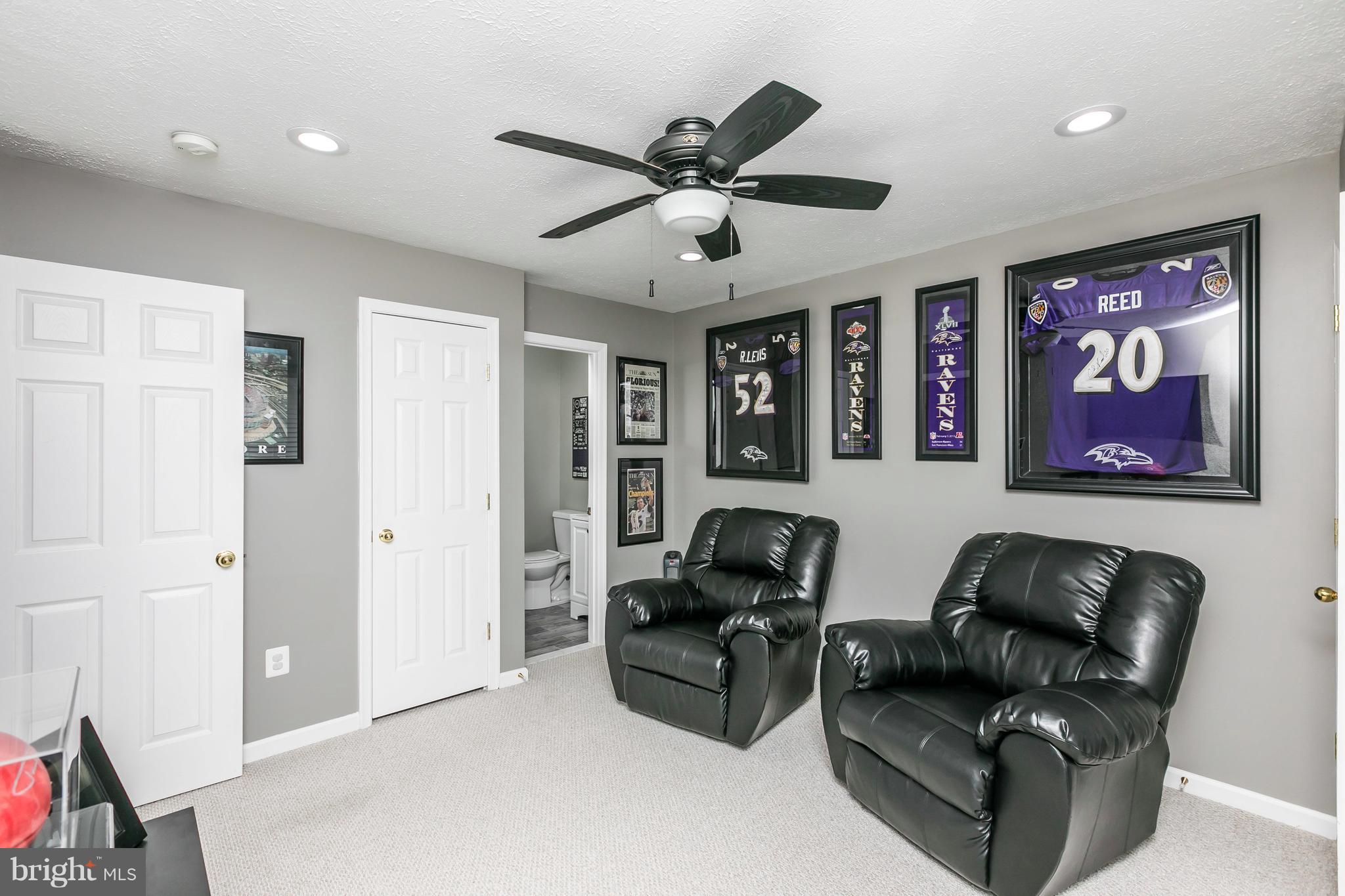 890 Lowe Road Middle River, MD 21220 - Photo 3 of 24 a living room with furniture ceiling fan and a rug