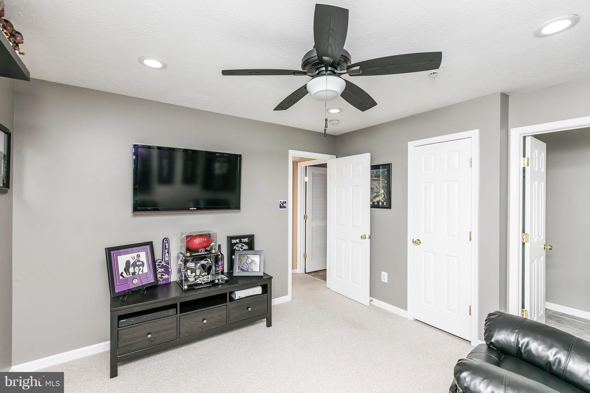 890 Lowe Road Middle River, MD 21220 - Photo 4 of 24 a living room with furniture and a flat screen tv
