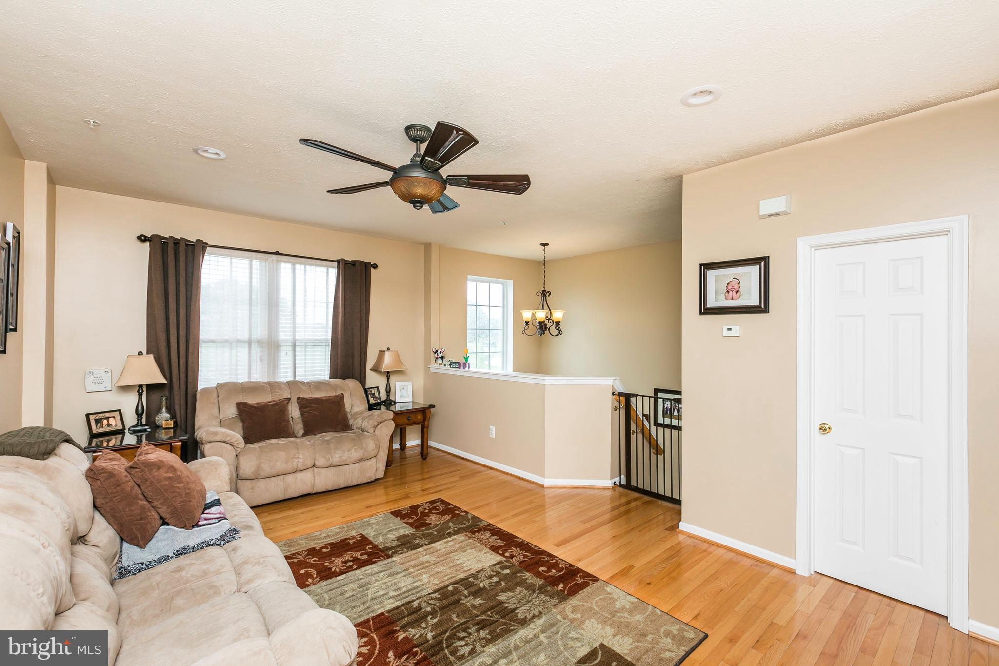 890 Lowe Road Middle River, MD 21220 - Photo 7 of 24 a living room with furniture and a rug
