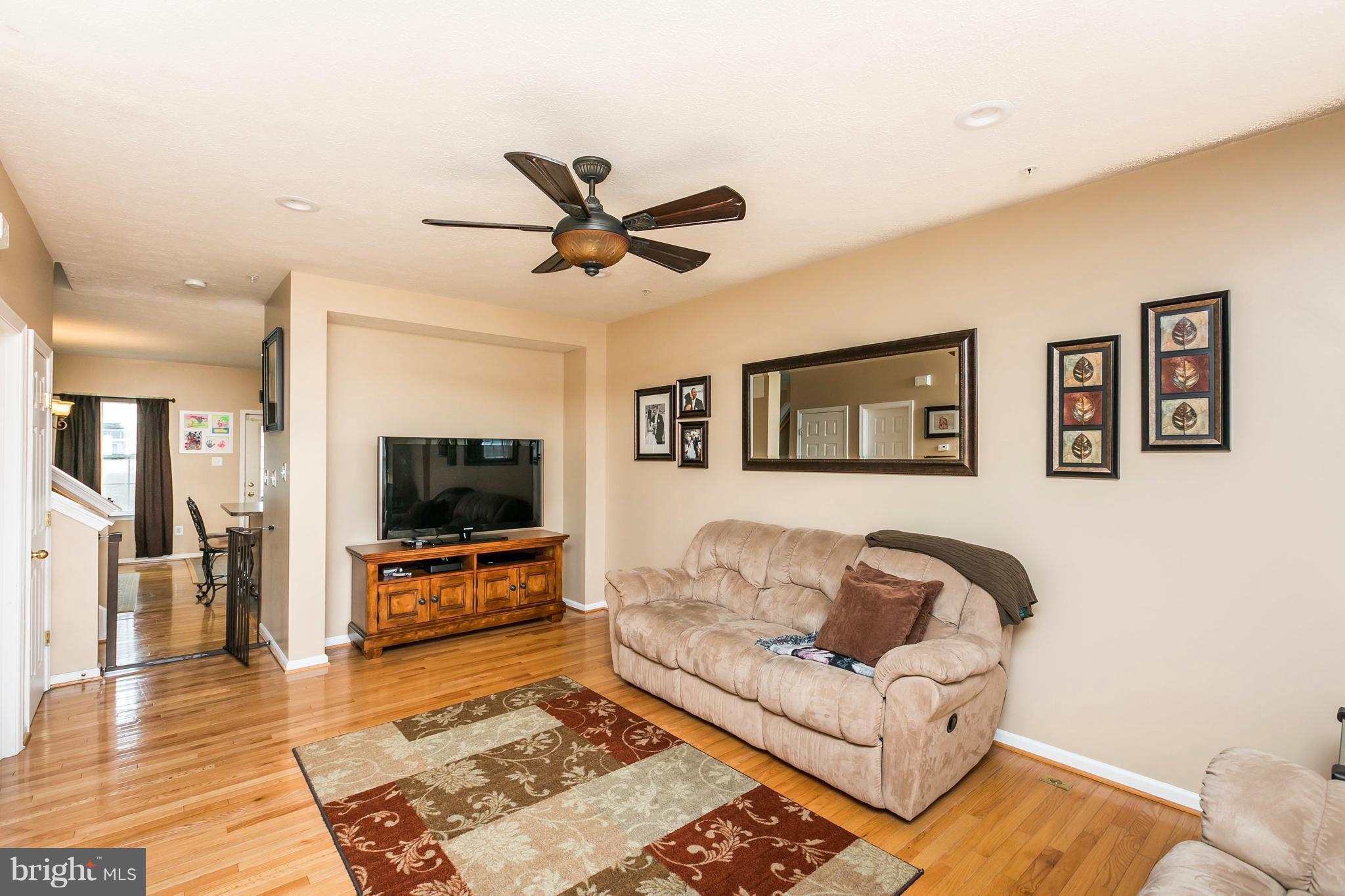 890 Lowe Road Middle River, MD 21220 - Photo 8 of 24 a living room with furniture and a flat screen tv