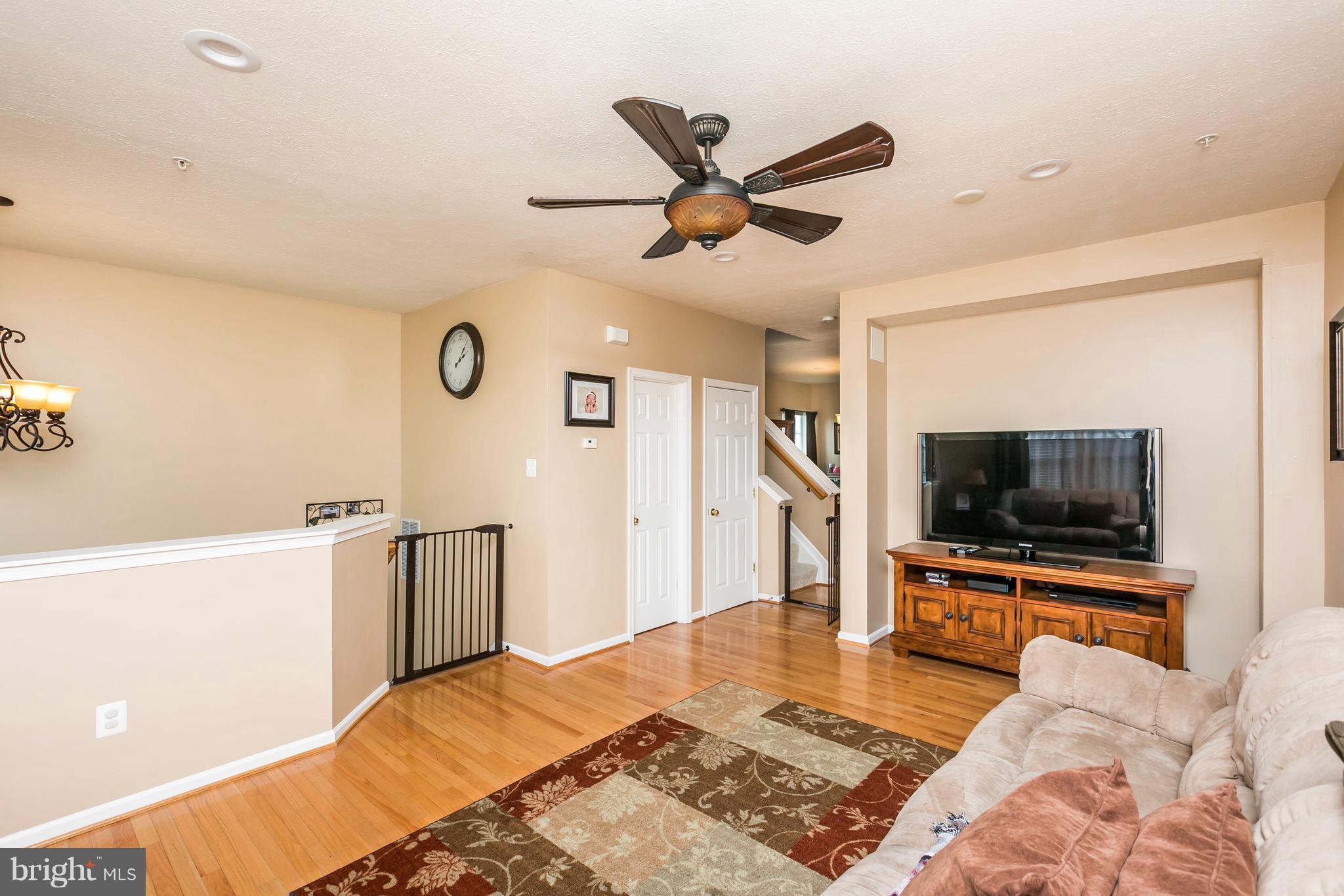 890 Lowe Road Middle River, MD 21220 - Photo 9 of 24 a bedroom with a bed and a flat screen tv