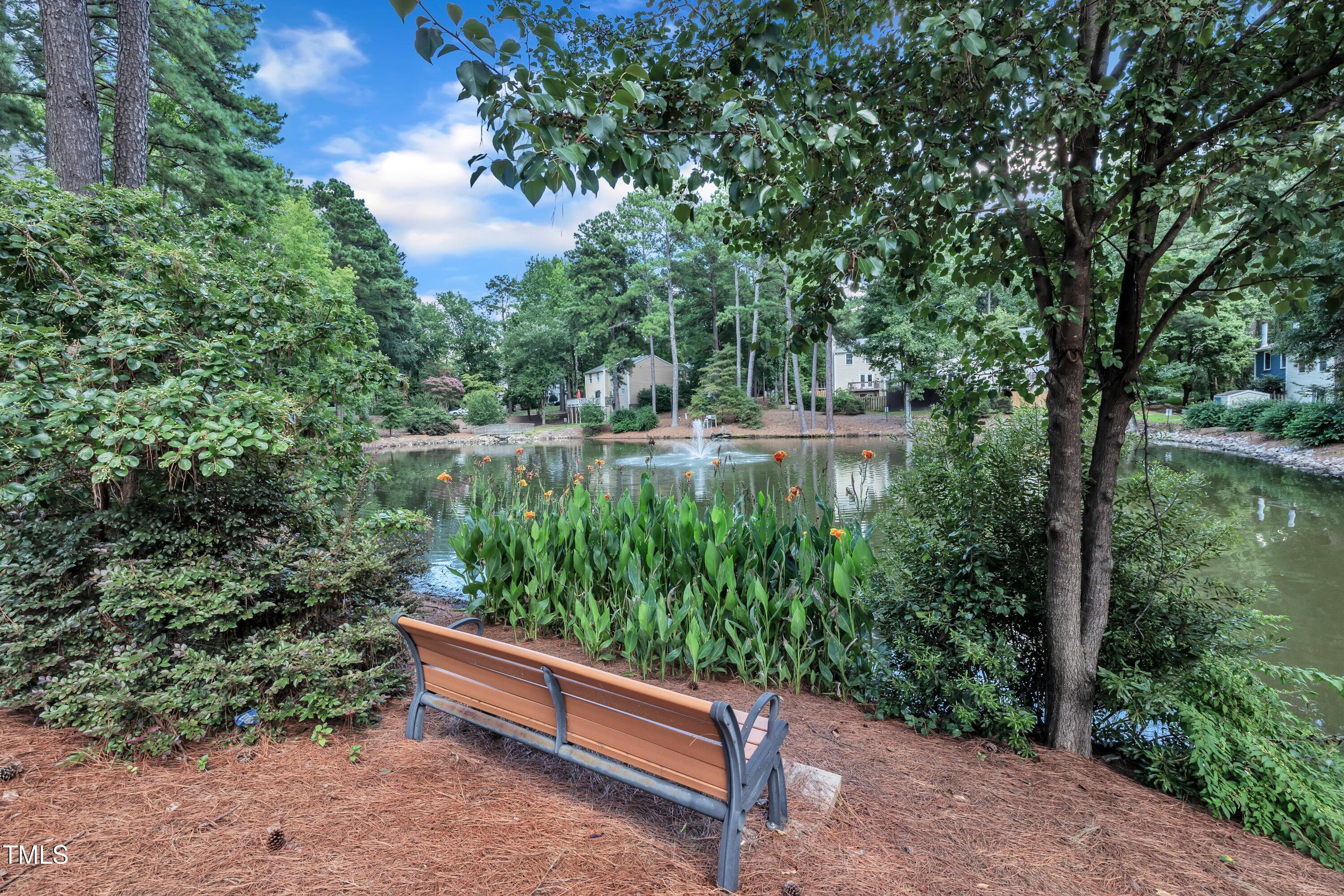 632 Middleton Avenue Cary, NC 27513 - Photo 6 of 34 a view of a garden with a bench in a garden