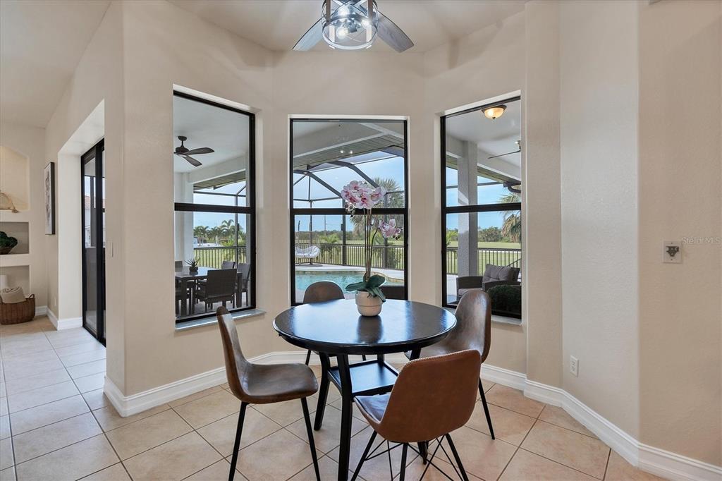 24017 Peppercorn Road Punta Gorda, FL 33955 - Photo 13 of 38 a dining room with furniture and window
