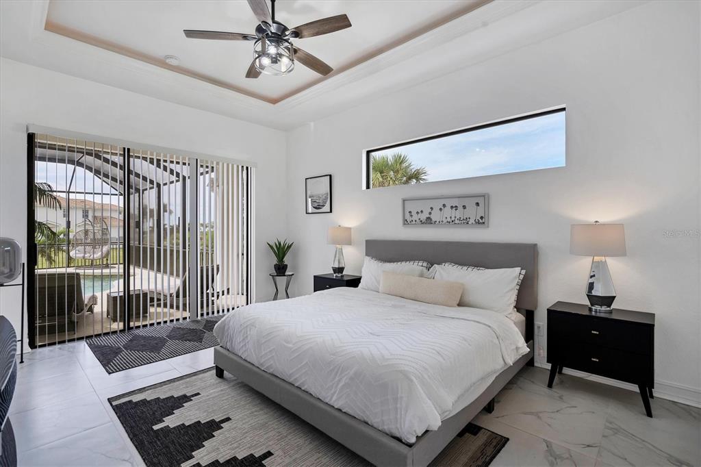 24017 Peppercorn Road Punta Gorda, FL 33955 - Photo 15 of 38 a bedroom with a large bed and a window