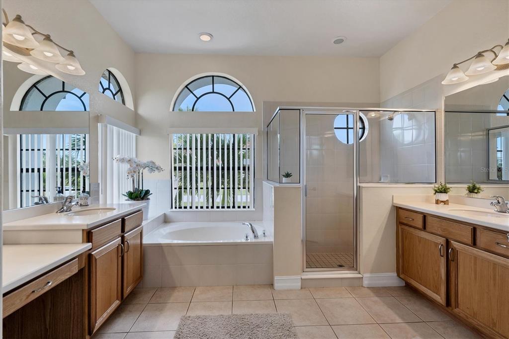 24017 Peppercorn Road Punta Gorda, FL 33955 - Photo 17 of 38 a bathroom with a tub sink and mirror