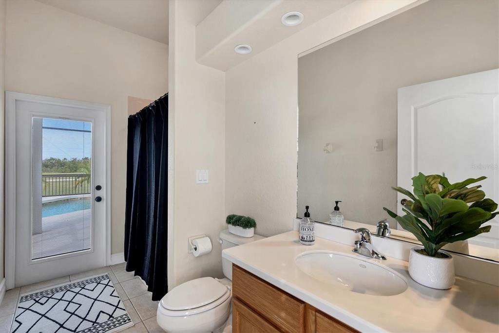 24017 Peppercorn Road Punta Gorda, FL 33955 - Photo 21 of 38 a bathroom with a sink a toilet and shower