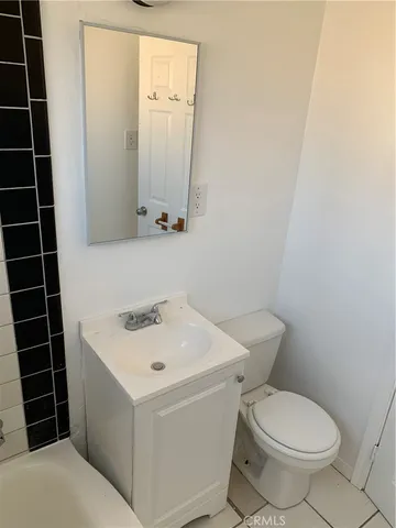 a bathroom with a bathtub and window