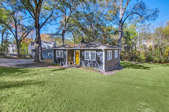 front view of a house with a big yard