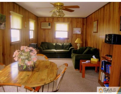 9 Matson Road Edison, NJ 08817 - Photo 5 of 10 a living room with furniture and a fireplace