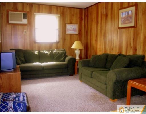 9 Matson Road Edison, NJ 08817 - Photo 6 of 10 a living room with furniture and a window