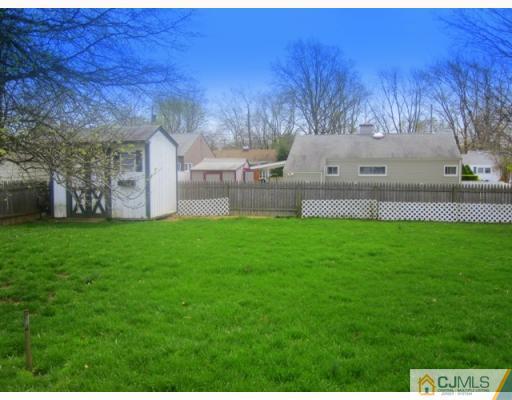 9 Matson Road Edison, NJ 08817 - Photo 10 of 10 a view of a garden with tall trees