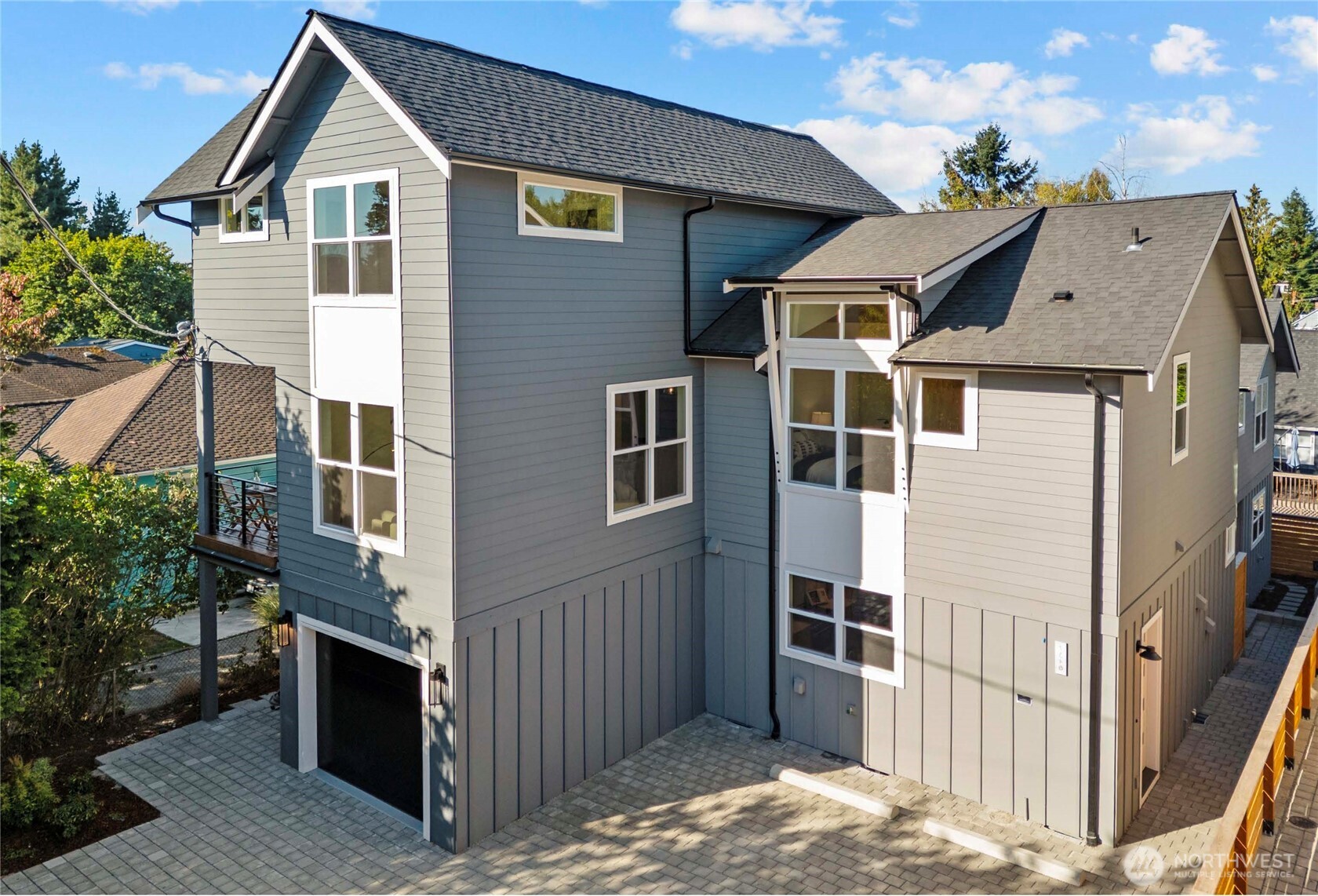 7350 22nd Avenue Northwest, Unit B Seattle, WA 98117 - Photo 1 of 24 a front view of a house with a yard