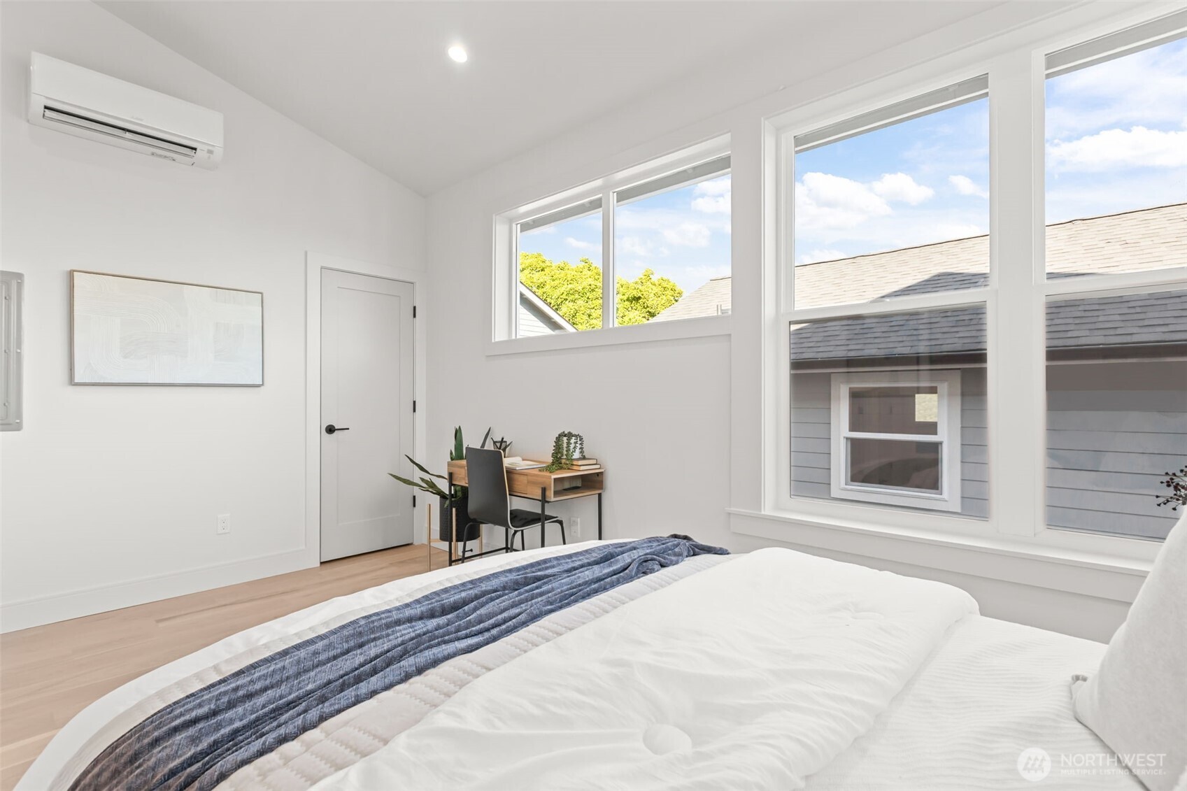 7350 22nd Avenue Northwest, Unit B Seattle, WA 98117 - Photo 15 of 24 a bedroom with a bed and a window