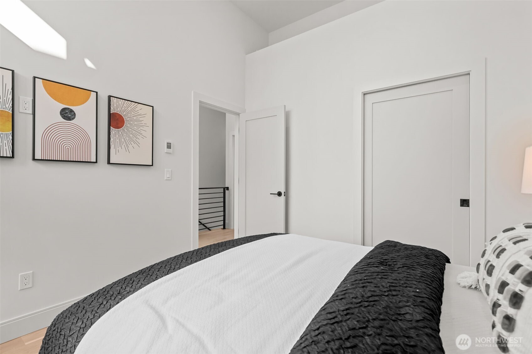 7350 22nd Avenue Northwest, Unit B Seattle, WA 98117 - Photo 19 of 24 a bedroom with a bed and painting on the wall