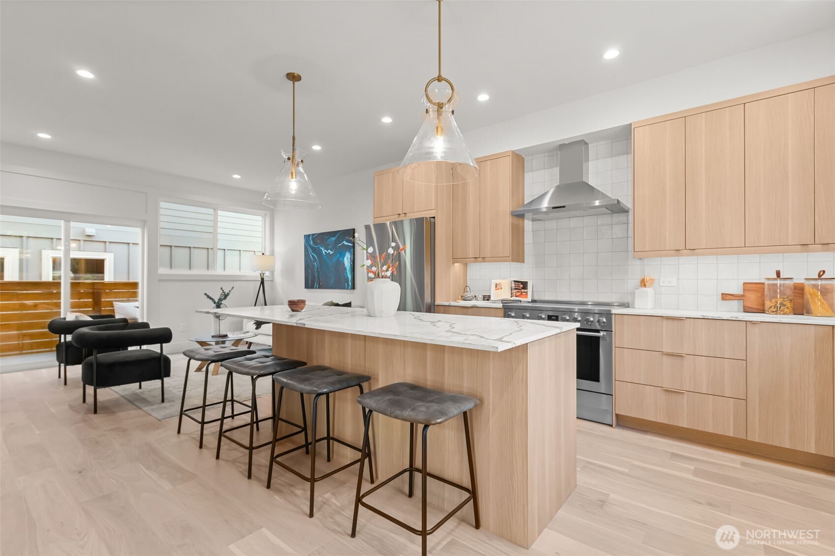 7350 22nd Avenue Northwest, Unit B Seattle, WA 98117 - Photo 8 of 24 a kitchen with stainless steel appliances kitchen island granite countertop a sink and cabinets