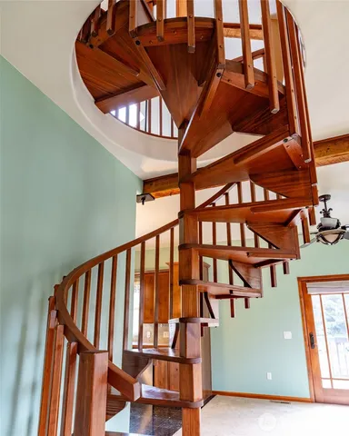 a view of staircase with a rug