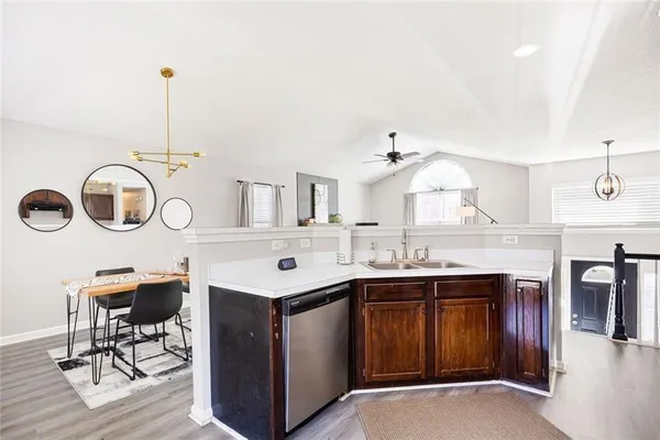 a bathroom with a tub sink and mirror